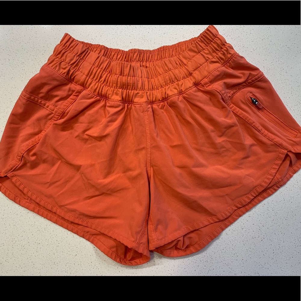 Lululemon orange tracker shorts 4”
